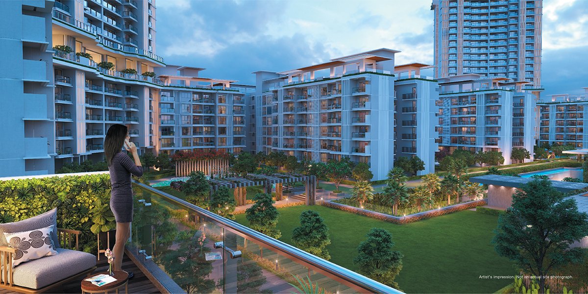 Godrej Woods Noida towers and landscaped podium at dusk